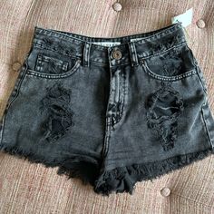 Edgy Black Jean Shorts. Rips In Front And Back. Frayed Bottom. Edgy Washed Black Shorts, Edgy Black Bottoms With Frayed Hem, Black Cotton Grunge Shorts, Ripped Black Grunge Bottoms, Black Ripped Grunge Bottoms, Black High Rise Bottoms In Grunge Style, Black High Rise Grunge Bottoms, Casual Black Bottoms With Frayed Hem, Black Grunge Bottoms With Frayed Hem