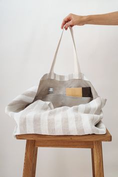 "This large linen beach bag is perfect for a long-awaited vacation, picnic, or trip to the beach. Beautifully made of soft heavyweight linen, with an extra linen lining inside. The bag is roomy enough to carry large towels along with other essentials. Linen is environmentally friendly, durable, and looks better and better with age. Color: white/natural stripes Bag size: Height: 35 cm / 14\" Length: 45 cm / 18\" Width: 22 cm / 9\" Handles: 26 cm / 10\" (Strap drop length) *Custom size available. Oversized Beach Bags, Perfect Beach Bag, Bag With Pockets, Tote Bags Sewing, Oversized Tote Bag, Striped Bags, Oversized Tote, White Beach, Summer Bag