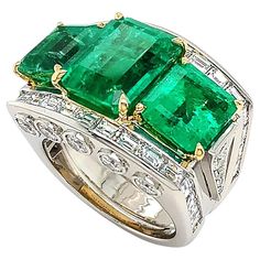 A remarkable green of emerald is the summit of this platinum ring adorned with diamonds. Three emeralds are displayed in emerald cuts, emphasizing brilliant hues and depth. 18k yellow gold prongs secure the gemstones. Platinum is the wide band, featuring a channel setting of baguette diamonds across the top and five bezel-set brilliant cut diamonds on each side of the bridge. Side stones of five ascending diamonds provide additional shine. The total weight is 10.36 carats of emeralds and 3.26 ca Expensive Diamond, Trio Ring, Channel Setting, Baguette Diamonds, Fancy Jewelry, Dress Rings, Emerald Jewelry, Platinum Ring, Emerald Gemstone