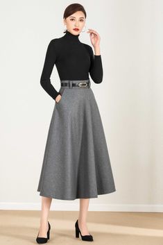 "Fluidity and elegance from this chic winter skirt. Team the wool skirt with a chunky sweater, winter boots, no matter what the weather throws at you! DETAIL * 30% wool, 30% fiber, 40% polyester * polyester lining * Two side pockets * Right zipper closure * Below knee length effect * Perfect for autumn winter * It will include a belt (not same with the model wear) * Lean More about the items From the FAQs on the page bottom SIZE GUIDE Size vary between Brand and Country Please get your body meas Black Pleated Skirt For Winter, Winter Midi Skirt In Solid Color, Chic Fitted Winter Skirt, Gray Flared Skirt For Fall, Fall Midi Skirt In Solid Color, Chic Winter Midi-length Bottoms, Elegant Winter Midi Bottoms, Chic Midi-length Winter Bottoms, Elegant Long Winter Skirt