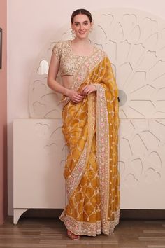 Yellow organza saree with floral, thread and sequins hand embroidery. Comes with a padded blouse. - Aza Fashions Designer Organza Pre-draped Saree With Dori Work, Silk Pre-draped Saree With Zari Work For Reception, Festive Organza Pre-draped Saree With Pallu, Yellow Organza Pre-draped Saree For Eid, Bollywood Organza Blouse Piece For Navratri, Bollywood Style Organza Blouse Piece For Navratri, Yellow Anarkali Style Pre-draped Organza Saree, Designer Organza Pre-draped Saree For Festivals, Yellow Art Silk Embroidered Fabric For Reception