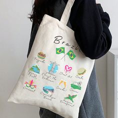 "Take Brazil with you wherever you go with this ultra cute souvenir tote. Perfect for your holiday or for every day. Features: - 15\" x 16\" - 100% durable cotton canvas - Heavy fabric (12 oz/yd² (406.9 g/m - Sewn-in label - 20\" handles  tags: Brazil gift, Brazil souvenir, Brazil tote, Brazilian landmarks, Sao Paulo Gift, Brazil tote bag, Brazilian souvenir, Brazil appreciation, Brazil flag tote, Brazil flag, Brazil pride, beach bag, grocery bag, Rio De Janeiro tote" Green Bag With Letter Print For Gift, Green Letter Print Bags As Gifts, Casual Canvas Gift Bag, Trendy White Canvas Bag For Gifting, Trendy White Canvas Bag As Gift, Trendy White Canvas Bag As A Gift, Casual Multicolor Canvas Bag For Gift, Casual Multicolor Canvas Bag As Gift, Flag Brazil