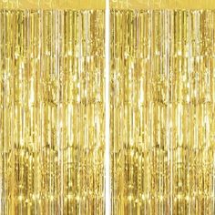 gold foil curtain with fringes hanging from it