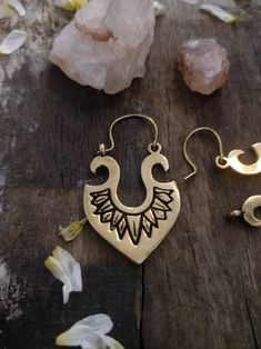 Elevate your boho style game with these stunning Tribal Danglers. Handmade with love and attention to detail, these earrings feature a gorgeous vintage boho design that is sure to set you apart from the crowd. Made with high-quality brass, these earrings offer both durability and unique charm. Whether you're dressing up for a casual evening or a romantic date night, these earrings are the perfect accessory to complete your look. Don't miss your chance to add these beautiful and one-of-a-kind earrings to your collection. Order now and embrace the beauty of bohemian style with our Tribal Danglers. Bohemian Bronze Chandelier Earrings For Pierced Ears, Bohemian Bronze Chandelier Earrings, Bronze Bohemian Chandelier Earrings, Bohemian Chandelier Earrings With Ear Wire For Festivals, Bohemian Bronze Chandelier Earrings With Ear Wire, Bohemian Adjustable Teardrop Earrings, Bohemian Teardrop Hoop Earrings With Ear Wire, Brass Chandelier Earrings For Festivals, Bohemian Gold Chandelier Earrings For Festival