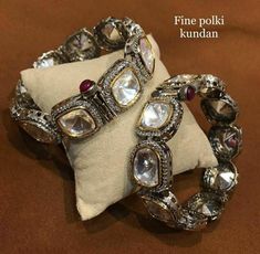 These Glam Victorian Polki Bangles Based in copper with rhodium plating. A perfect accessory for almost anything. This beautifully handcrafted bangle is set in silver and copper alloy and plated with 22k gold. It will go with everything and make your outfit super chic. Perfect to wear to dinner, and perfect gift for family members, friends or bridesmaid. LENGTH Bangle Size - 2.4 Closure - Screw. ...DETAILS -100% top Quality Faux Glass Polki -22K gold and silver Plated silver Handmade Silver Bangle For Celebration, Luxury Silver Bracelets For Festivals, Silver Stone Work Bangle, Silver Bracelet With Stone Work For Festive Occasions, Silver Temple Jewelry Bangle For Formal Occasions, Silver Bracelets With Stone Work For Festive Occasions, Silver Metal Bracelet With Stone Work, Festive Silver Bracelet With Stone Work, Festive Silver Bracelets With Stone Work