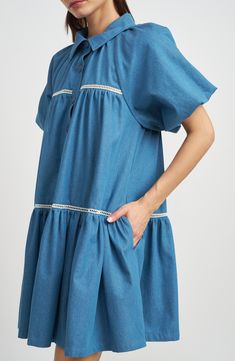 Shirtdress style gets a flowy trapeeze remix in a tiered cotton option accented with delicate lace and popped with pair of pockets. 33" length (size Small) Front button closure Spread collar Short sleeves Side-seam pockets Lined 100% cotton Hand wash, line dry Imported Knee-length Chambray Dress With Pockets, Knee-length Medium Wash Shirt Dress With Pockets, Casual Button-up Chambray Dress, Casual Chambray Button-up Dress, Blue Chambray Denim Dress - Relaxed Fit, Shirt Dress Style, Shirtdress, Chambray, Top Brands