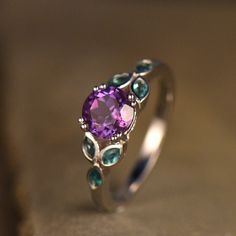 This is a green purple(color changing)alexandrite with marquise cut lab created emerald ring in 925 sterling silver. The stone color can vary depending on lights. This ring is marked 925 Main stone is 6.5mm oval cut,about 1.0ct. Size stone: 3x5mm marquise cut lab created emerald. I accept custom making order.Please contact me if you need this service. All the jewelry in my store is handmade.It may take 2-3 weeks to finish. For all the jewelries,there is a 14 days money back guarantee.You can ret Purple Green Ring, Green And Purple Ring, Purple And Green Engagement Ring, Purple And Green Wedding Rings, Emerald Green Engagement Ring Silver, Engagement Rings Purple Stone, Amethyst And Emerald Ring, Emerald Green And Purple Wedding, Purple Wedding Rings