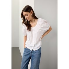 White (100% Cotton). Top. 3/4 sleeves. Crew neck. Front button closure. 22.5" from shoulder to hemline. Imported. Cotton Blouse With 3/4 Sleeves For Day Out, Casual Spring Puff Sleeve Top With Button Closure, Casual Spring Puff Sleeve Top, Half Sleeve Blouse For Day Out, Classic Cotton Puff Sleeve Top For Summer, Spring Button-up Cotton Puff Sleeve Top, Spring Cotton Puff Sleeve Button-up Top, Chic Relaxed Fit Half Sleeve Blouse, Relaxed Fit Puff Sleeve Top For Everyday Spring Wear