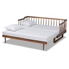 a wooden bed frame with two pillows on top of it and one mattress in the middle