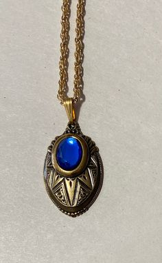 "This is for a beautiful layered Victorian Look Pendant. Oval Brass pendant with a Blue color Glass stone accent 1 1/2\" long x 1\" wide Inspired by the \"Golden Era\" 23\" gold Plate rope Chain Thanks for looking" Blue Oval Locket Necklace, Oval Blue Locket Necklace, Formal Blue Locket Jewelry, Antique Blue Jewelry With Large Pendant, Antique Blue Brass Jewelry, Blue Brass Pendant Jewelry, Blue Medallion Locket Necklace, Blue Medallion Jewelry With Adjustable Chain, Elegant Blue Locket Necklace Gift