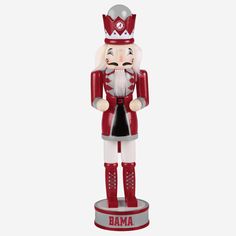 a red and white nutcracker statue with the word obama on it's chest