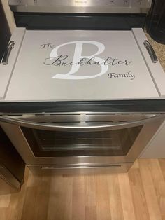 a stainless steel oven with the letter b on it