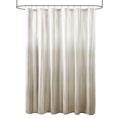 a white shower curtain hanging on a metal rod