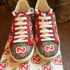 These Are Preowned 100% Authentic Gucci, Apple Sneakers. Were Only Worn Twice. Comes With Original Box And Two Dust Bags. Low Top Lace Up Sneaker With The Iconic Supreme Gg Monogram Coated Canvas Upper With Red Apple Accents. Made In Italy. Leather Insole And Lining, Flats With Rubber Outsole. Comes From A Pet & Smoke Free Home. Chinese Valentine's Day, Gg Monogram, Gucci Shoes, Red Apple, Lace Tops, Womens Shoes Sneakers, Low Top, Womens Sneakers, Original Box