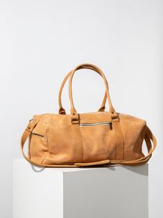 Meet your new travel buddy. Made with rugged, oil-tanned leather, this Ethiopian bag combines classic and cool. Product Photography Bags, Bag Photography, Coffee Gifts Card, Photography Bags, Travel Buddy, Weekend Bag, Coffee Gifts, Congo Kinshasa, Wallet Bag