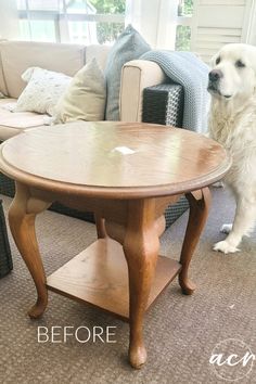 a dog standing next to a table in a living room