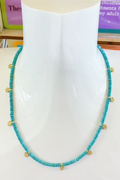 Delicate and dreamy, this Daisy Turquoise Necklace is the perfect balance of sweet and chic. Small turquoise beads are strung together with tiny gold daisy charms that add a playful touch of charm to your neckline. Whether you're pairing it with a sundress for brunch or layering it with other necklaces for a casual day out, this dainty piece brings a little sunshine to any outfit. Swimsuit Jewelry, Daisy Charm, Drinking Accessories, Candle Party, Jeweled Earrings, Sneaker Slippers, Sunglasses Shop, Wide Brimmed Hats, Gift Accessories