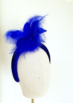 Little Hats for Grand Occasions. Customer information and sizing. Royal blue,cobalt blue feathers and hand curled quills on a velvet padded headband, fascinator, halo.  Perfect statement headband for weddings, special events, racing or a grand occasion. Embellishments, feathers, buttons and brooches are lovingly sourced for unique individual pieces. Headband measures 4cm at it's top widest point and sits comfortably on the head. Handmade in the UK. No two designs are the same. Please message me to discuss any personnal requirements. Return and exchanges except within 14 days. Please read the full details in the FAQS. Many more designs on the shop. Adjustable Blue Headband Costume Hat, Blue Adjustable Headband Costume Hat, Adjustable Blue Costume Headband, Blue Headband For Kentucky Derby, Adjustable Blue Headband Fascinator, Blue Adjustable Headband Fascinator, Blue Feather Trim Headpiece For Wedding, Blue Headband For Royal Ascot, Adjustable Blue Fascinator With Feather Trim