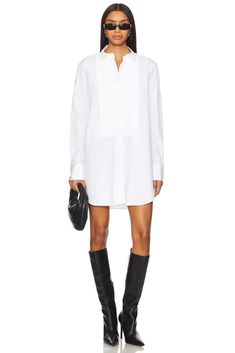 97% cotton 3% polyurethane.  Made in China.  Dry clean only.  Front button closure.  Buttoned cuffs.  Buttoned shoulder seam.  Midweight poplin fabric with curved hem.  .  .  .  .  .  .  .  .  . White Oversized Poplin Shirt, Deconstructed Shirt, Deconstructed White Shirt, Oversized Poplin Button-up Top, Fearless Women, Off Shoulder Shirt, Shoulder Shirts, Made In China, Poplin Fabric