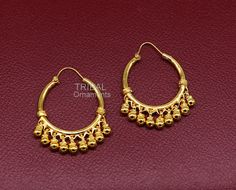 Amazing gold polished over pure 925 sterling silver amazing stylish antique design hoops earrings bali, fabulous hanging bells, awesome gifting tribal jewelry form Rajasthan india. Metal-925 Sterling silver. Type- stud earrings Stamp-925. Weight-12.040 grams length-4.4 centimeter with bells. Width-3.0 centimeter. Finish-Gold polished over 925 sterling silver bali. Makes excellent gifting and collectible pieces. Intricate Dangle Hoop Earrings For Festivals, Festive Brass Hoop Earrings With Latkans, Traditional Brass Hoop Earrings For Festivals, Traditional Festive Brass Hoop Earrings, Traditional Hoop Danglers For Festivals, Brass Hoop Earrings With Latkans For Festivals, Small Hoop Jewelry With Intricate Design For Festivals, Temple Jewelry Hoop Earrings For Festivals, Intricate Small Hoop Jewelry For Festivals