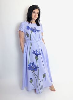 Hand painted cornflower maxi loose washed linen dress with pockets, Lilac blue long linen dress with short sleeves, MaTuTu Linen Style Casual Flax Short Sleeve Dress, Blue Short Sleeve Maxi Dress With Pockets, Light Blue Short Sleeve Relaxed Fit Dress, Light Blue Relaxed Fit Short Sleeve Dress, Flax Short Sleeve Summer Dress, Flax Colored Short Sleeve Summer Dress, Short Sleeve Lavender Maxi Dress For Spring, Beach Dress In Flax With Short Sleeves, Spring Linen Dress In Flax Color With Short Sleeves