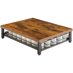 a wooden table topped with lots of white dishes on top of metal racks and legs