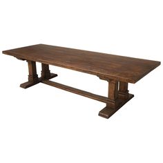 an old wooden table with two legs and a long slab on the top, against a white background