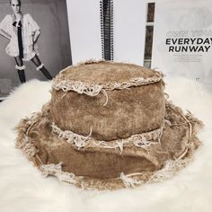 This Stylish And Trendy Tan Distressed Bucket Hat Is Perfect For Any Fashion-Conscious Woman. Made From High-Quality Denim Fabric, This Hat Is Both Durable And Comfortable To Wear. Its Distressed Design Adds A Touch Of Rugged Appeal, Making It The Ideal Accessory For Any Casual Outfit. With Its One-Size-Fits-Most Design, This Bucket Hat Is Suitable For Women Of All Sizes. Its Brown Color Is Versatile And Can Be Paired With Any Outfit. The Hat's Style Is Unique And Fashionable, Making It A Must-H Vintage Washed Hats For Summer, Vintage Washed Summer Hats, Bohemian Distressed Summer Hats, Distressed Brown Summer Hat, Distressed Wide Brim Hat For Summer, Distressed Wide Brim Summer Hat, Casual Wide Brim Distressed Hat, Vintage Distressed Beach Hat, Summer Distressed Adjustable Bucket Hat