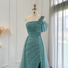 This one-shoulder evening dress radiates luxury and elegance with its sage green color and exquisite design. Perfect for weddings, formal events, and parties, this dress combines style and sophistication. Look and feel like royalty in the beautiful and unique luxury Dubai dress. window.adminAccountId=244214477; Green One-shoulder Wedding Gown, Green Evening Dress With Asymmetrical Neckline For Party, Green One-shoulder Evening Dress For Wedding, Green Asymmetrical Neckline Party Evening Dress, Green One-shoulder Gown With Fitted Bodice, Green Asymmetrical Neckline Party Dress, Green One Shoulder Floor-length Evening Dress, Green Evening Dress With Asymmetrical Neckline For Gala, Green One-shoulder Floor-length Evening Dress