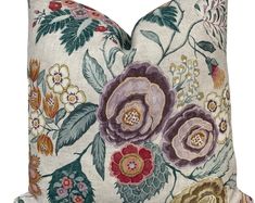 a pillow with flowers and leaves on it