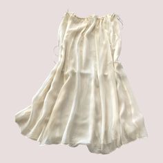 This delightful silk chiffon skirt is very versatile and can be worn over a slip, leggings, bathing suit, etc., or wear it as a slip. Pair it with one of our tops for a seamless dressed up look. Small - Medium fits up to 42" hip; Large fits up to 54" hip. This skirt features princess seams and drawstring ties on both sides of the waist. To prevent shrinkage, hand wash in cold water, hang to dry, or dry cleaning is recommended. This item is made just for you. Please allow 2 weeks for delivery. Fo Flowy Midi Skirt Summer Dress, Chic Sheer Flowy Skirt, Flowy Silk Maxi Skirt For Spring, Spring Silk Flowy Maxi Skirt, Summer Stretch Dresses With Tiered Skirt, Stretch Summer Dresses With Tiered Skirt, Summer Daywear Flowy Maxi Skirt, Stretch Tiered Skirt Dress For Summer, Summer Stretch Tiered Skirt Dress