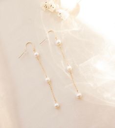 3 Pearl Drop Earring, Pearl Dangle Earring, Bridal earrings, Long chain earrings, June's birthstone Pearl, Bride to be gift, wedding earring --- made to order -- Inspired by bridal season, these freshwater pearl dangle earrings are the perfect statement piece. 3 sweet fresh water pearls embellished down our favorite sparkly chain for the most delicate accent. Details: 3 freshwater pearls, 6mm each. Drop of earring is 2.5 inches. Gold filled or sterling silver. Hypoallergenic and tarnish resistan Dainty Gold Dangle Earrings, Bridal Earrings Hair Down Gold, Elegant Chandelier Earrings With Adjustable Chain, Pearl Chain Drop Earrings For Gift, Pearl Chain Linear Drop Earrings For Gifts, Classic Threader Drop Earrings For Wedding, Classic Wedding Threader Drop Earrings, Delicate Dangle Linear Earrings For Anniversary, Dangle Bridal Earrings With Pearl Chain