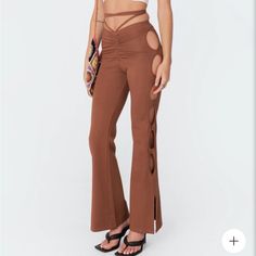 Edikted Cut Out Flare Plants- Brown Size: S I’m 5’2 And They Are Long, But Able To Be Tied And It Looks Just As Cute! Fitted Bottoms With Cut-out Waist For Night Out, Fitted Summer Bottoms With Cut-out Waist, Fitted Cutout Bottoms For Night Out, Trendy Brown Summer Pants, Trendy Brown Bottoms For Day Out, High Waist Stretch Bottoms With Cutout Details, Chic Cutout Bottoms For Spring, Spring Bottoms With Cutout Details, Trendy Summer Pants For Night Out