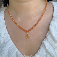 Thank you for coming in!  Breath-taking gem imperial topaz nugget bead necklace with a beautiful center pendant and 18k solid gold spacers and clasp! 17" to 19" adjustable length necklace! You'll get the necklace you see! SIZE of the beads: 5.2mmx4mm-5mmx6mm, 6.68mmx13mm bezel MATERIAL: 18k solid gold, Imperial Topaz Gold Rondelle Crystal Necklace With Gemstone, Gold Beaded Gemstones As Gift, Gold Beaded Gemstones For Gift, Beaded Gold Gemstones For Gift, Gold Citrine Beaded Necklace For Gift, Gold Single Strand Gemstones As Gift, Pear Pendant, Imperial Topaz, Length Necklace