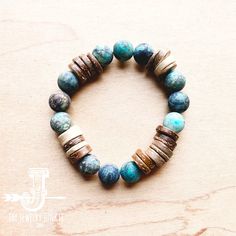 Frosted African Turquoise and Wood Stretch Bracelet Adjustable Turquoise Beaded Bracelets With Wooden Beads, Turquoise Beaded Bracelets With 8mm Beads For Beach, Bohemian Blue Beaded Bracelets With Wooden Beads, Blue Bohemian Beaded Bracelets With Wooden Beads, Adjustable Turquoise Bracelets With Wooden Beads, Brown Beaded Bracelets With Natural Stones For Beach, Brown Natural Stone Beaded Bracelets For Beach, Brown Natural Stones Beaded Bracelets For Beach, Turquoise Wooden Beads Bracelet