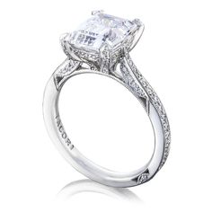 an engagement ring with a princess cut diamond in the center