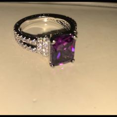 There Are Also Clear Tiny Crystals Around The Ring. This Is A Size 8 Elegant Purple Jewelry Promise Ring, Elegant Purple Jewelry For Promise Ring, Purple Cubic Zirconia Ring Jewelry, Purple Open Ring Formal Jewelry, Formal Purple Open Ring Jewelry, Purple Ring With Accent Stones, Purple Amethyst Promise Ring With Vs Clarity, Elegant Purple Rings Stamped 925, Vvs Clarity Amethyst Ring