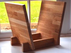 a wooden sculpture sitting in front of a window