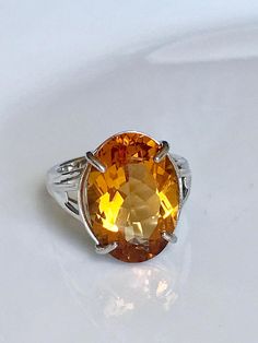 Citrine Engagement Ring, Gemstone Engagement Ring, Statement Rings, Cocktail Ring, November Birthsto Modern Yellow Topaz Ring For Anniversary, Modern Yellow Topaz Anniversary Ring, Elegant Orange Yellow Sapphire Rings, Elegant Orange Topaz Ring, Orange Citrine Topaz Ring, Orange Topaz Ring For Anniversary, Fine Jewelry Style, Orange Topaz Ring With Prong Setting, Elegant Orange Topaz Ring With Center Stone, Orange Citrine Birthstone Rings