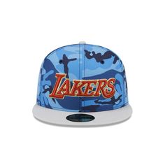 The Los Angeles Lakers Blue Camo 59FIFTY Fitted Cap features an embroidered Lakers wordmark logo at the front panels with matching NBA Logoman at the rear and a gray undervisor. Sports Fitted Hat With Logo Patch And Flat Bill, Sporty Flat Brim Fitted Hat For Fans, Throwback Blue Baseball Season Hats, Blue Snapback Hat With Logo Patch For Sports, Sporty Snapback Fitted Hat For Fan Merchandise, Sporty Snapback Fitted Hat For Fans, Sporty Fitted Hat With Logo Patch And Flat Bill, Sporty Flat Brim Trucker Hat For Fan Merchandise, Sports Fitted Hat With Flat Bill And Letter Patch