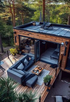 an aerial view of a deck with couches and tables in the middle of it