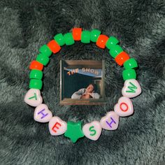 This product is a sturdy friendship bracelet made from pony beads. It would make a great gift for fans of Niall Horan. Novelty Green Beaded Bracelets For Friendship, Friendship Beaded Bracelets With Letter Beads, Green Plastic Beaded Bracelets As Gift, Rainbow Cake, Pony Beads, Gummy Bears, Niall Horan, Braided Bracelets, Friendship Bracelet