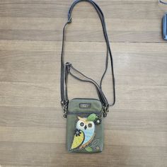 Chala Handbags Owl Gen A Cellphone Crossbody Handbag-Convertible Strapdimensions: 5" X 7.5" X 1" Strap Adjustable: 7"~30" Small Front Pocket Adorned With Our Owl A Design Adjustable Strap - Turn Bag Into A Purse, A Crossbody Bag, Or Even A Pouch! Top Zipper Closure Leaf Zipper Pull Soft Lining Inside 3 Credit Card Slots Inside 2 Adjustable Straps That Are Detachable Extra Padding Throughout Bag To Protect Your Cell Phone Materials: Faux Leather Color: Olive Description: Owl A - Cell Phone Xbody Casual Phone Bag With Detachable Strap, Satchel Shape, Casual Satchel Phone Bag With Detachable Strap, Green Crossbody Phone Bag With Adjustable Strap, Casual Phone Bag With Detachable Strap, Casual Phone Shoulder Bag With Detachable Strap, Casual Green Phone Bag For Everyday, Casual Pouch Phone Bag For On-the-go, Everyday Green Phone Bag With Zipper Closure, Casual Phone Bag With Detachable Strap For On-the-go