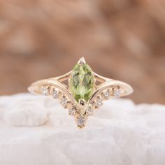 "Vintage style victorian womens wedding ring, Antique 14k solid yellow gold marquise cut green peridot engagement ring, Promise ring for her WE OFFER UNLIMITED PERIOD INSTALLMENTS PLAN This is a beautiful, stunning, feminine ring that works well for all occasions, styles, and ages. You will love it! Ring information Main stone: Peridot Approximate size: 8x4mm Accent stones: White cubic zirconia Approximate size: 1.5mm (5 stones) Approximate size: 1.25mm (4 stones) Metal type: Gold Metal stamp: 1 Green Marquise Diamond Ring For Formal Occasions, Green Marquise Diamond Ring For Formal Events, Formal Green Marquise Diamond Ring, Green Marquise Diamond Ring Fine Jewelry, Green Marquise Diamond Promise Ring, Gold Marquise Gemstone Wedding Jewelry, Elegant Peridot Diamond Ring, Elegant Peridot Ring Jewelry, Exquisite Marquise Cut Yellow Gold Ring