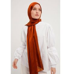 Shine Hijab Shawl - Cinnamon Glossy in texture and elegant in appearance, our shine shawl is set to be the next great addition to your wardrobe! Its sleek shine makes for an impressive final touch to formal wear so you could look and feel your best on any special occasion. FEATURES: - Glossy finish - Suitable for all seasons - Opaque (not transparent) MATERIAL: - 75 cm x 185 cm - Polyester CARE: - Hand wash separately in cold water. - Lay flat to dry. - Iron on low without steam. Made in Turkey Elegant Shawl For Eid And Formal Occasions, Elegant Shawl For Formal Eid Occasions, Elegant Formal Shawl For Eid, Elegant Pashmina Shawl For Eid, Elegant Eid Pashmina Shawl, Elegant Solid Color Shawl For Fall, Elegant Wedding Hijab, Elegant Brown Hijab, Lydia Elise Millen