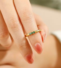 This dainty emerald stacking band is an elegant piece of jewelry, meticulously crafted from 14k real gold. It features a minimalist design with a slender band, making it ideal for stacking or wearing alone. The ring showcases three vibrant emerald stones, adding a touch of color and sophistication. Perfect as a marriage or matching band, this ring exudes timeless elegance and is designed for women who appreciate refined, minimalist jewelry. Welcome to HeroWing, we promise all the rings are 100% Stackable Yellow Gold Emerald Ring For Promise, Minimalist Gold Emerald Stackable Ring, Yellow Gold Stackable Emerald Ring For Promise, 14k Gold Emerald Half Eternity Ring For May Birthstone, 14k Gold Half Eternity Emerald Ring For May Birthstone, Minimalist Gold Emerald Birthstone Ring, Dainty Yellow Gold Emerald Open Ring, Dainty Emerald Stackable Birthstone Ring, Minimalist 14k Gold Emerald Ring For Anniversary