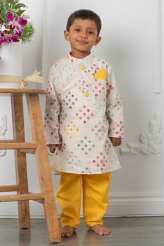 Off white kurta with mirrorwork embellishments. Comes with matching pyjama.
Components: 2
Pattern: Embroidered
Type Of Work: Mirrorwork
Neckline: Mandarin Collar
Sleeve Type: Full
Fabric: Cotton, Cotton Satin, Lining: Mul Mul Cotton
Color: Off White
Other Details: 
Straight silhouette
Note: Pocket square worn by the model is not for sale
Occasion: Festive and Wedding - Aza Fashions Festive Off White Straight Kurta Set, Festive Off White Sets With Straight Kurta, Festive Off-white Sets With Straight Kurta, Festive Off-white Gota Work Sets, Off White Gota Work Sets For Diwali, Off White Sets With Gota Work For Diwali, Traditional Festive Pant Set With Mirror Work, Cotton Pant Set For Designer Wear At Festivals, Multicolor Embroidery Sets With Gota Work For Eid