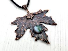 This natural leaf necklace is handcrafted with love and passion in my home studio. A beautiful pendant made from real maple leaf and little agate cabochon, covered with strong, pure copper layer. DETAILS: - This maple leaf pendant is already made and ready to ship - Black wooden box and jute bag included. Great gift package - Copper chain with clasp included. Choose your length in personalization menu - Free international shipping - Ships with tracking number within 1 business days once ordered! Handmade Leaf-shaped Nature-inspired Jewelry, Nature-inspired Leaf Shaped Copper Jewelry, Unique Handmade Leaf-shaped Necklace, Unique Handmade Leaf Necklace, Handmade Leaf Necklace, Maple Leaf Necklace, Citrine Crystal Necklace, Driftwood Jewelry, Jewelry Nature