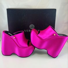 Nwt$1225 Versace Leather Triplatform Wedge Mules In Cerise Pink Color Sz 35, 5 Bold And Daring, Versace's Mules Are Made In Italy Of Luxurious Satin Enhanced With A Squared Toe. This Pair Is Anchored By A Striking Wedge Heel And Platform. Viscose/Silk Upper Square Open Toe Slip-On Style Leather Sole Made In Italy Size Leather-Covered Wedge Heel, 6.25" (160mm) Brand New From Saks Fifth Avenue!! Strikeout To Prevent Returns. Two Tiny Scuff Mark From Laying In Box At Store (See Pic - Hardly Noticea Luxury Platform Wedge Sandals, Elegant Pink Wedge Sandals For Parties, Designer Evening Wedge Sandals With Platform, Designer Platform Wedge Sandals For Evening, Luxury Synthetic Wedge Heels, Designer Formal Wedge Sandals With Platform, Elegant Pink Wedge Sandals With Round Toe, Modern Pink Platform Heels, Designer Platform Wedge Sandals