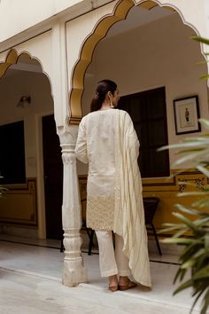 Cotton Off White Embroidered Suit Set with Doria Dupatta The set consists of straight cut cotton kurta with embroidery detailing has v neck, 3/4th sleeves teamed with solid palazzo pants and doriya dupatta to match. The set is a loose style garment. Kurta Length-38 inches (Length can be customised) Palazzo Length- 38 inches. (Length can be customised) Work-Embroidery Detailing Color-Off White Suit Fabric-Cotton Dupatta Fabric-Cotton Sleeves - 3/4th Sleeves Neck-V Neck Washing Care-Dry Clean Embroidered Suit, White Suit, Embroidery Detailing, Cotton Dupatta, Cotton Kurta, Suit Fabric, Loose Style, Suit Set, Palazzo Pants